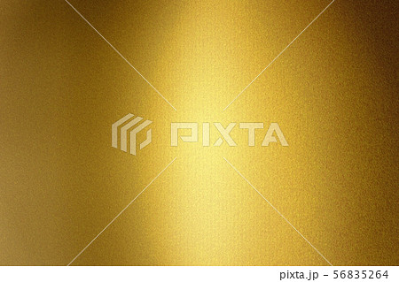Light shining on gold metallic foil wall, abstract 56835264