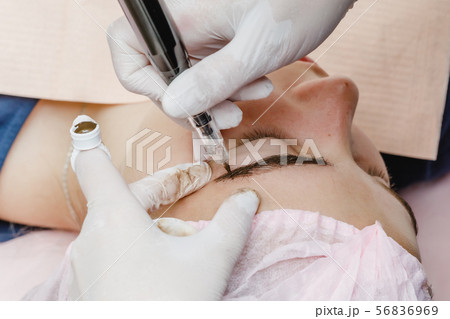 Permanent makeup, tattooing of eyebrows. Permanent makeup, tattooing of eyebrows. 56836969