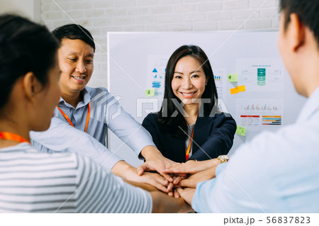 Business people showing unity and collaboration gesture 56837823