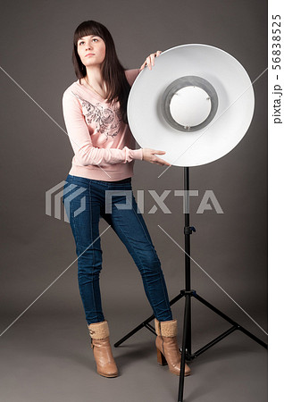 Beautiful young woman pose in photo-studio Beautiful young woman pose in photo-studio 56838525