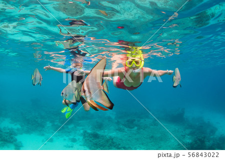 Mother, kid in snorkeling mask dive underwater Mother, kid in snorkeling mask dive underwater 56843022