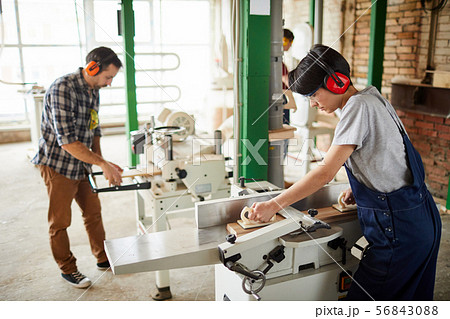 Workers Using Woodworking Machines 56843088