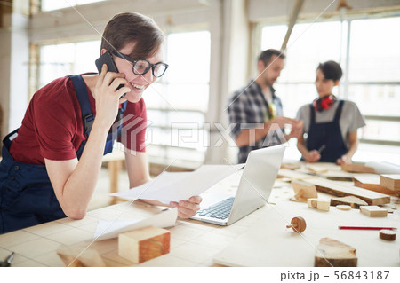 Young Man Managing Carpentry Business 56843187