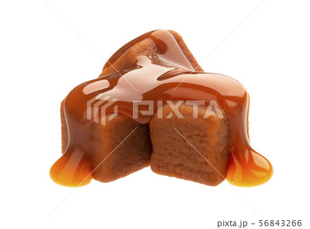Caramel candies and caramel sauce isolated on white background Caramel candies and caramel sauce isolated on white background 56843266