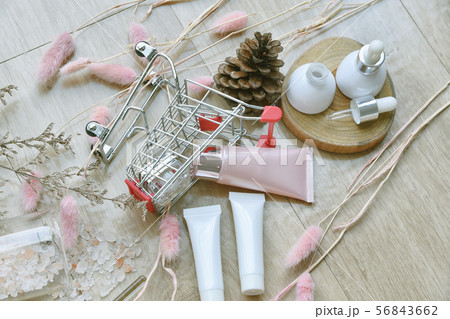 Cosmetic bottle container in shopping cart, Beauty 56843662