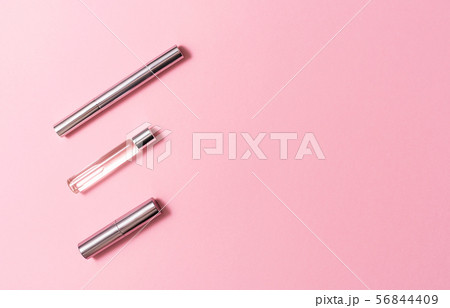 Flat lay composition with decorative makeup products and parfume on pink background. Makeup and Flat lay composition with decorative makeup products and parfume on pink background. Makeup and 56844409