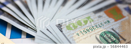 Huge pack of US money and bank card lying down on important financial document 56844463