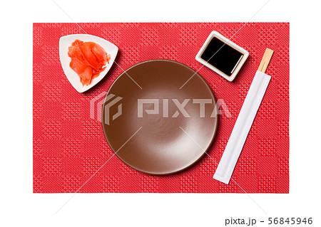 Empty round brown plate with chopsticks for sushi 56845946