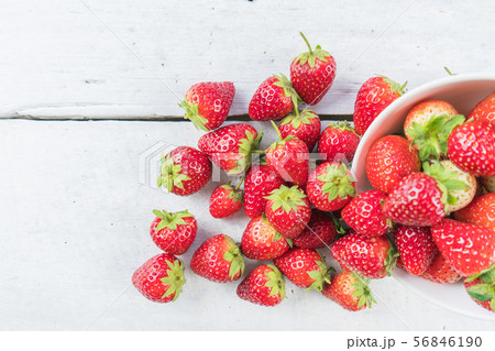 Strawberries on white wood table Strawberries on white wood table 56846190