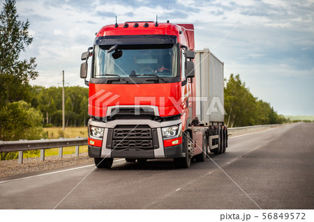 Red truck on a road in summer Red truck on a road in summer 56849572