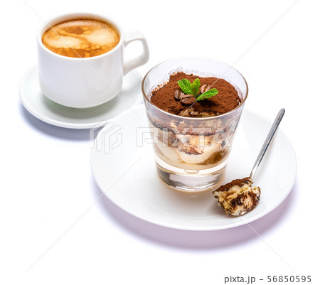 Classic tiramisu dessert in a glass cup, savoiardi cookies and coffee beans on white background with 56850595