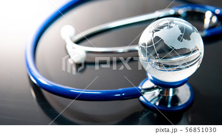 World globe crystal glass on stethoscope 56851030