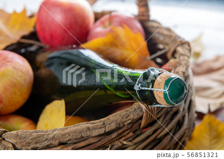 basket with bottle of cider and delicious apples, basket with bottle of cider and delicious apples, 56851321
