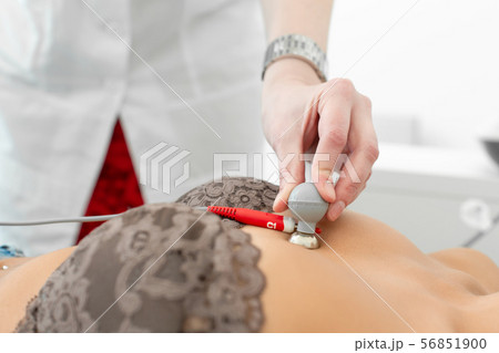 The therapist connects the electrocardiograph The therapist connects the electrocardiograph 56851900