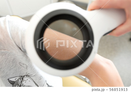 pediatric dermatologist examines a girl with a pediatric dermatologist examines a girl with a 56851913
