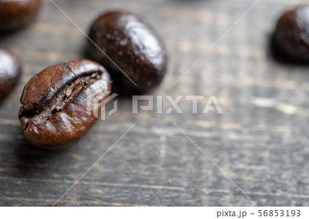 close up Coffee beans on wooden table. Copy space close up Coffee beans on wooden table. Copy space 56853193