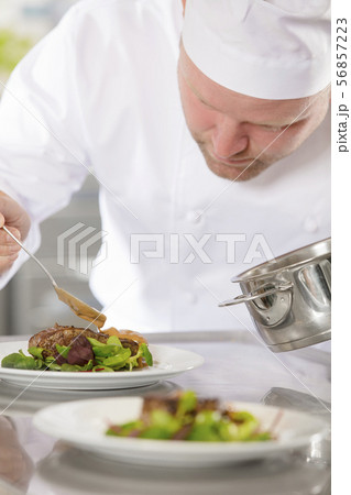 Professional chef prepare meat dish at restaurant 56857223
