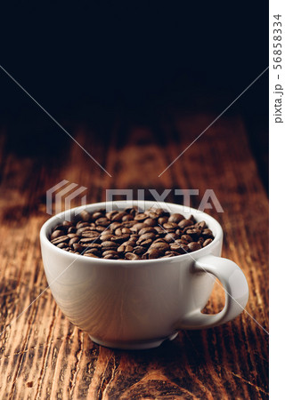 Roasted coffee beans in cup Roasted coffee beans in cup 56858334