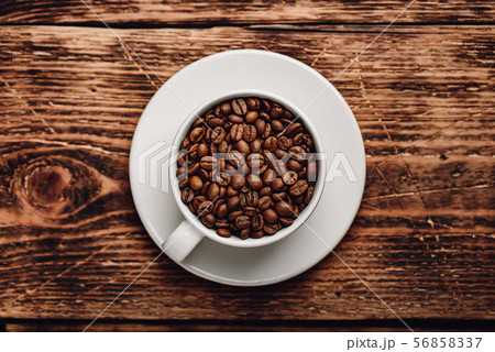 Roasted coffee beans in cup Roasted coffee beans in cup 56858337