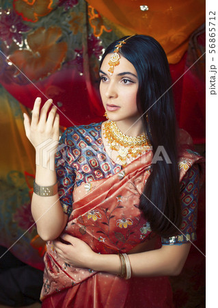 beauty sweet real indian girl in sari smiling cheerful, jewelry shining, lifestyle people concept 56865712