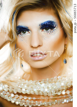 bright blond young woman with fashion style makeup posing sensual 56865713