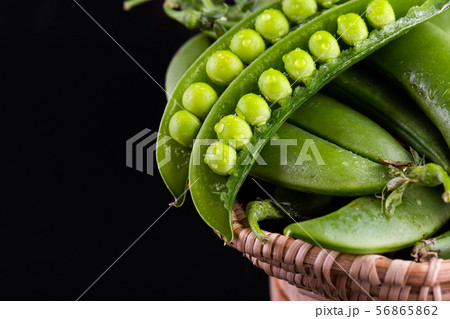 Sugar snap peas with mint on a rustic wood 56865862