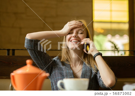 blond woman laughing 56871002