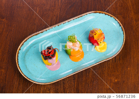 Tapas with salmon, octopus and prawn Tapas with salmon, octopus and prawn 56871236