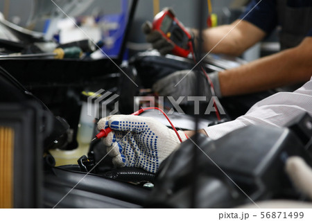 Two specialists of service for repairing wiring Two specialists of service for repairing wiring 56871499