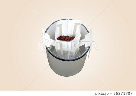 Drip bag fresh coffee on cup . OJECT Drip bag fresh coffee on cup . OJECT 56871707