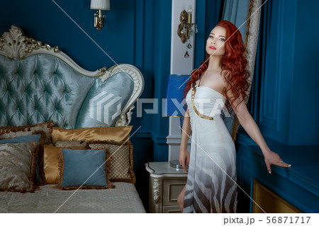 Beautiful red-haired woman in expensive Beautiful red-haired woman in expensive 56871717