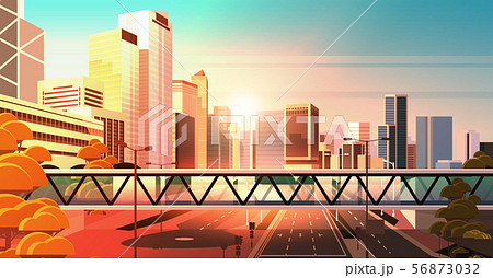 footbridge over highway asphalt road with marking arrows traffic signs city skyline modern 56873032