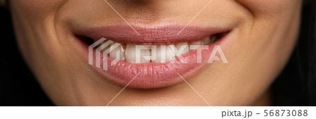 Wide open confident smile of pretty mature woman 56873088