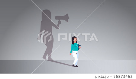 girl dreaming about being manager or boss screaming in megaphone shadow of business woman with 56873462