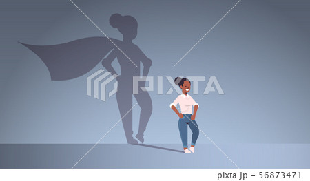 african american businesswoman dreaming about being super hero shadow of woman with cape imagination african american businesswoman dreaming about being super hero shadow of woman with cape imagination 56873471