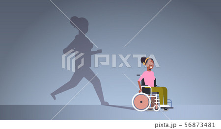 disabled african american girl on wheelchair dreaming about recovery shadow of healthy woman running 56873481