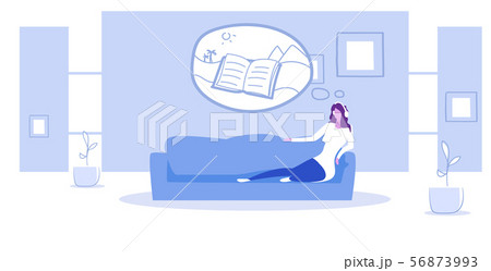 woman lying on couch listening audio book through headphones summer vacation concept modern living 56873993