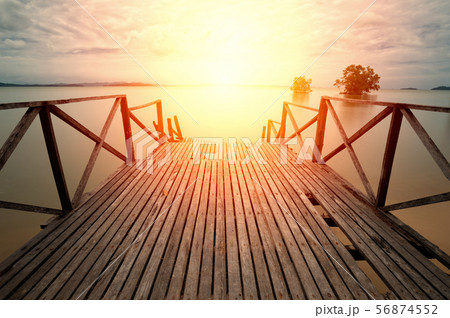 Wooden pier and soft water surface . 56874552