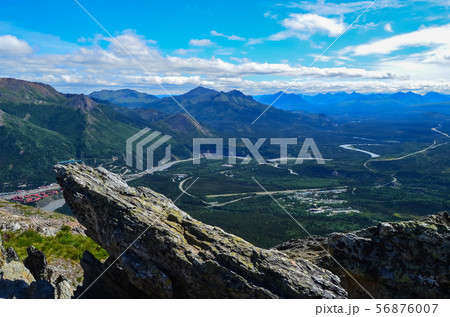 View of Nenana river valley from Mount Healy hike trail with blue sky with white clouds above 56876007