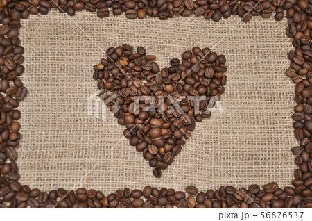 Coffee beans in heart shape. On rag cloth background 56876537