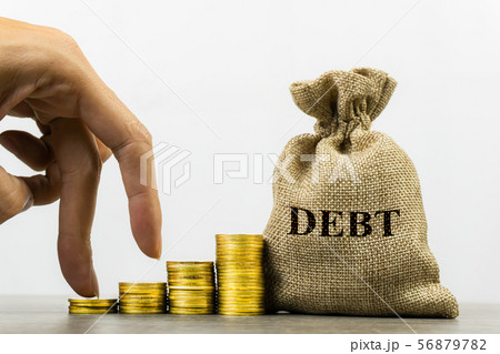Financial debt concept. A man hand on stack of Financial debt concept. A man hand on stack of 56879782