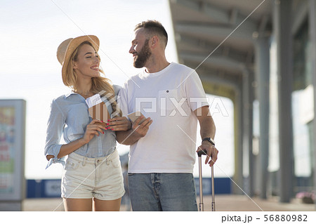 Newlyweds arriving at airport, going on honeymoon Newlyweds arriving at airport, going on honeymoon 56880982
