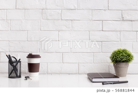 Modern and stylish office desktop with coffee to go and supplies 56881844