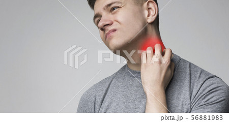 Young man scratching his itchy neck with allergy rash Young man scratching his itchy neck with allergy rash 56881983