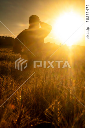 African woman in traditional clothes Sunset Field 56883472