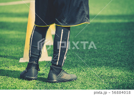 Children feet with soccer boots training on 56884018