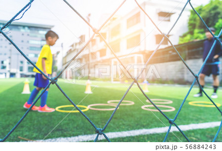 Soccer Academy field for children training blurred Soccer Academy field for children training blurred 56884243