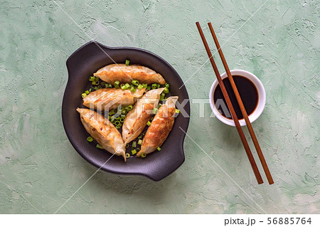 Fried Asian dumplings in bowl Fried Asian dumplings in bowl 56885764