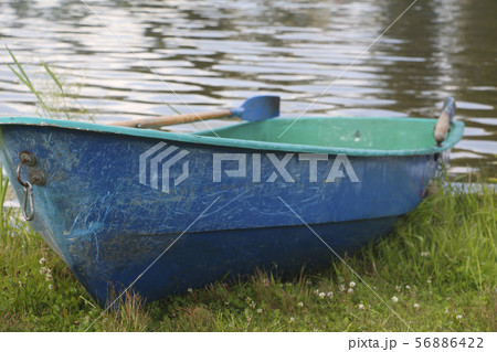One boat on the lake. Empty fishing boat. 56886422