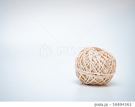 wool ball on light grey background 56894363